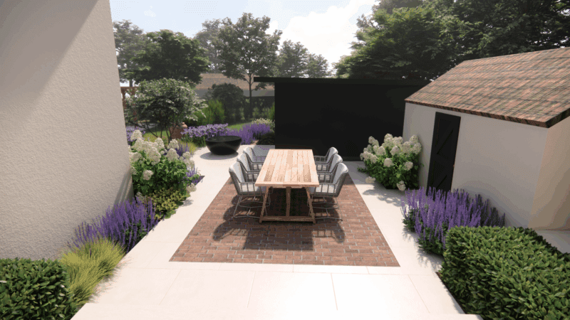 A landscaped listed property garden with white flowers, purple plants, green shrubs, and trees beside a light-colored house. There’s a round black adezz bayou water feature and a paved path under a blue sky with scattered clouds. This is a garden for a listed property.